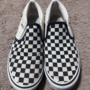 Black and white checkered slip on vans